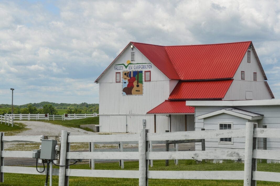 A photo of a white barn.