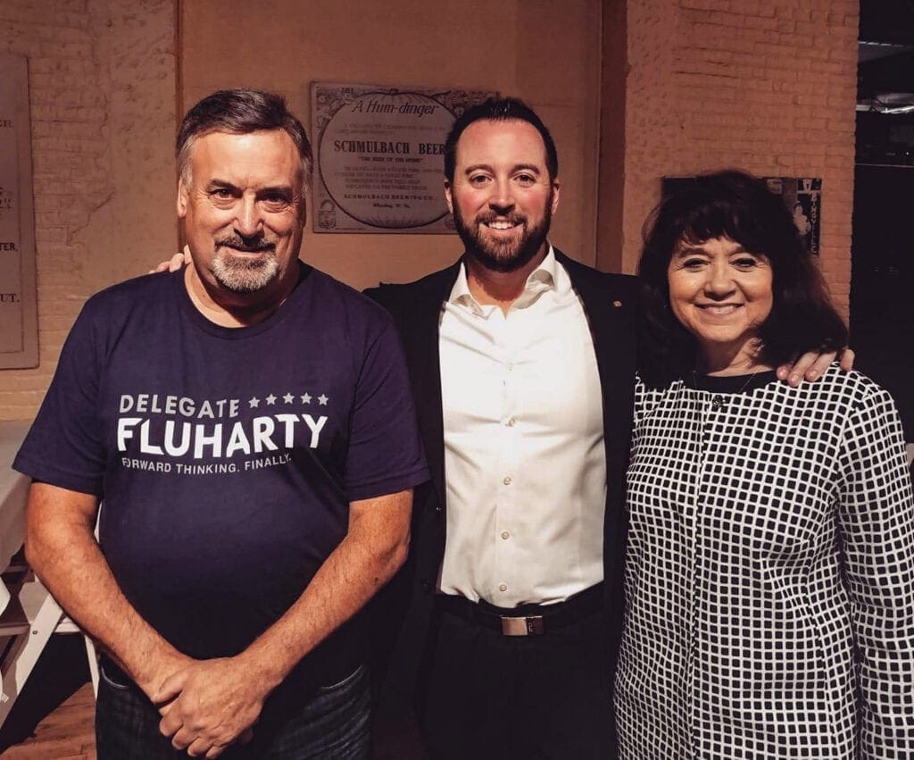 A man with his parents.