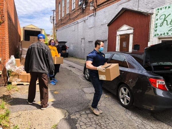 A man carrying a box.