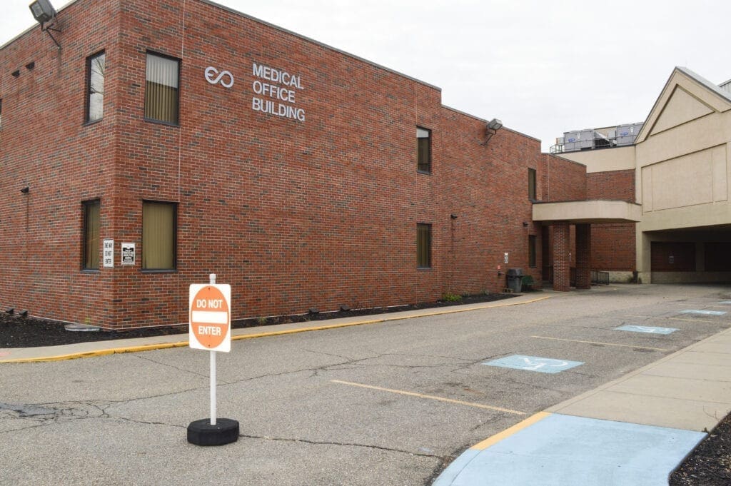 There are buildings surrounded the medical facility.