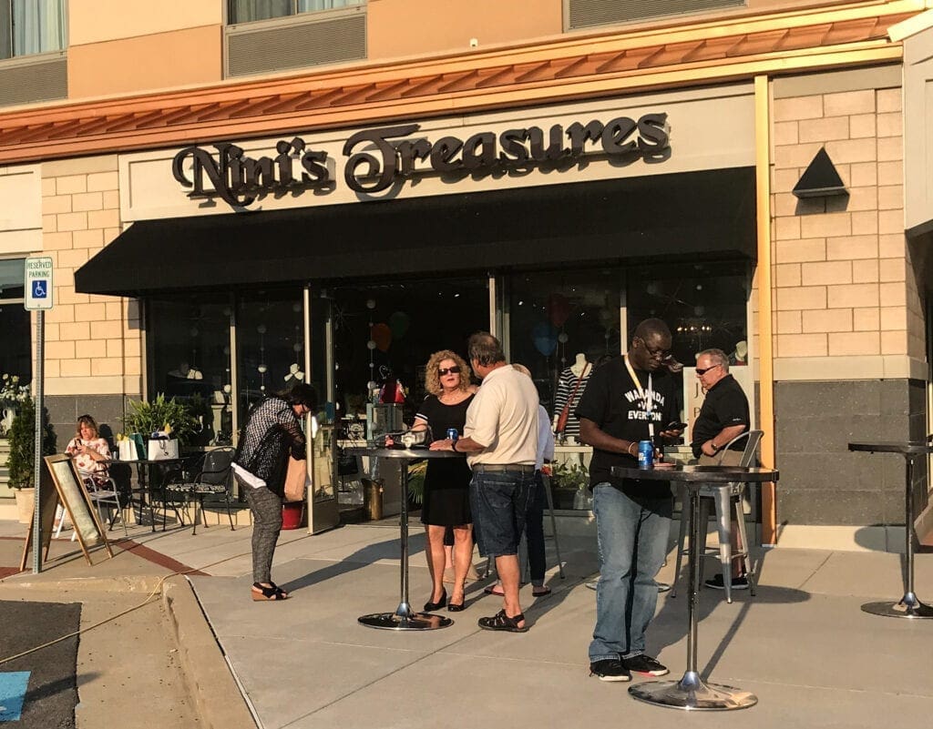 storefront with tables outside.