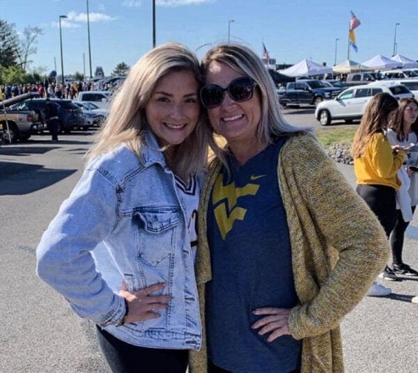 A mother and daughter at a football.