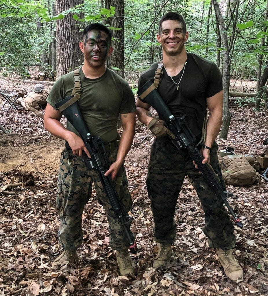 Two men doing military training.