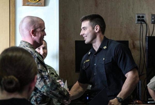 Two men shaking hands.