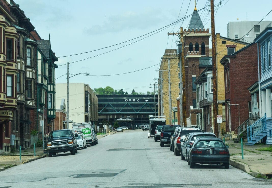 A photo of a hospital located in the middle of a residential area.