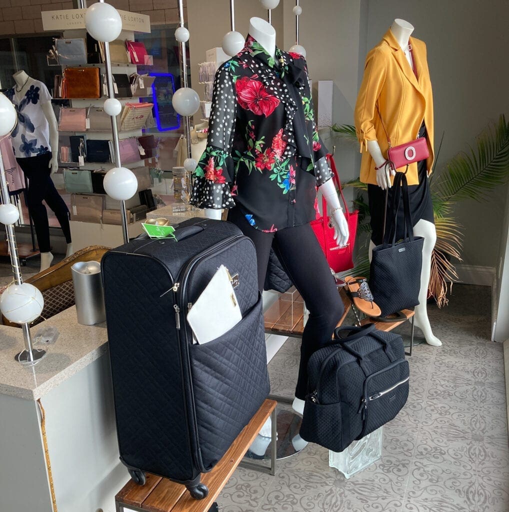 A store display with luggage.