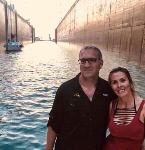 A man and woman inside a dam lock.