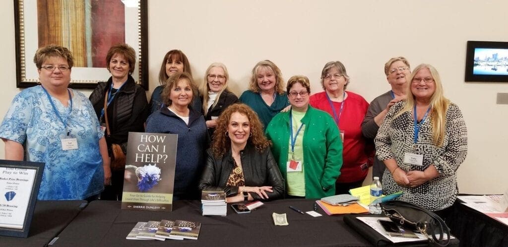 A group of ladies at a book signing.