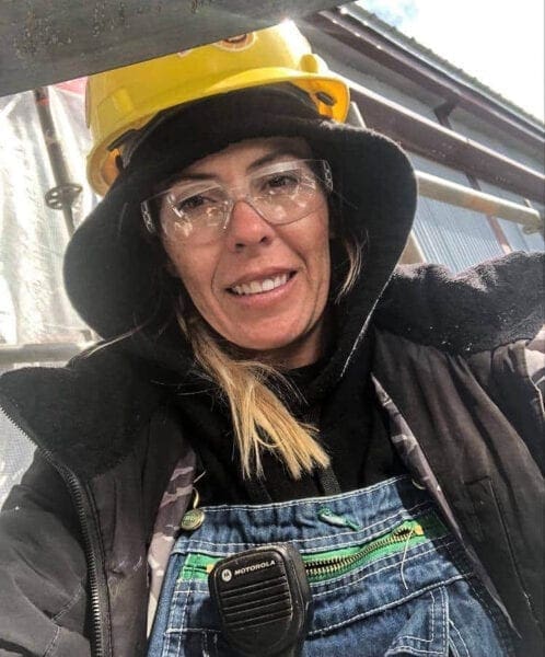 A woman wearing a hard hat.