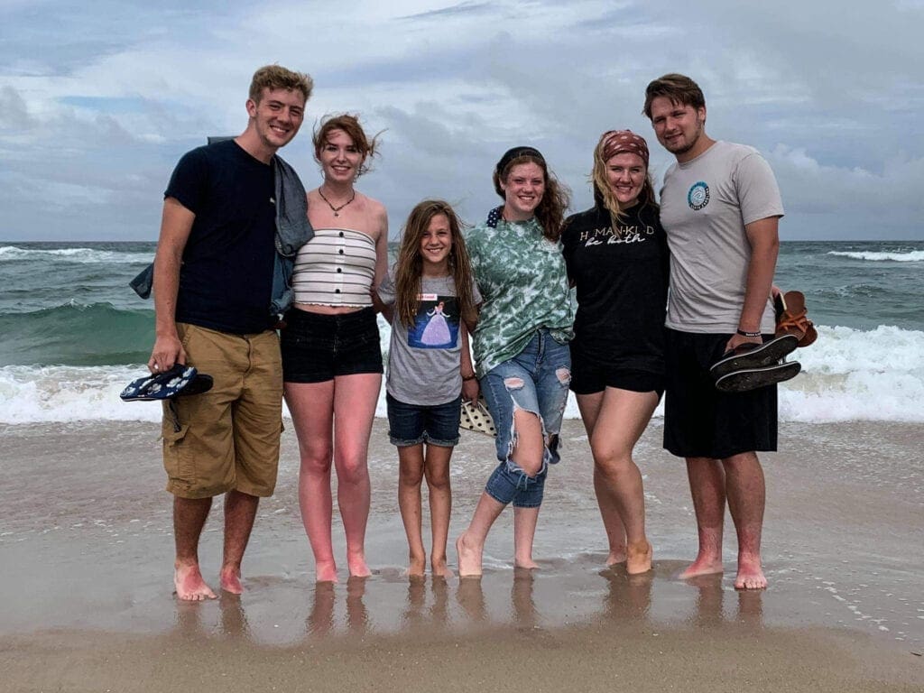 A photo of children on the beach.