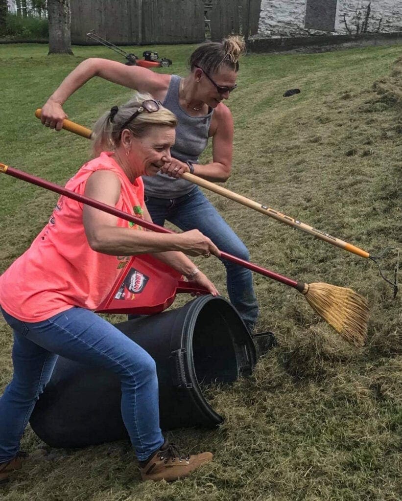 Two ladies doing yard work.