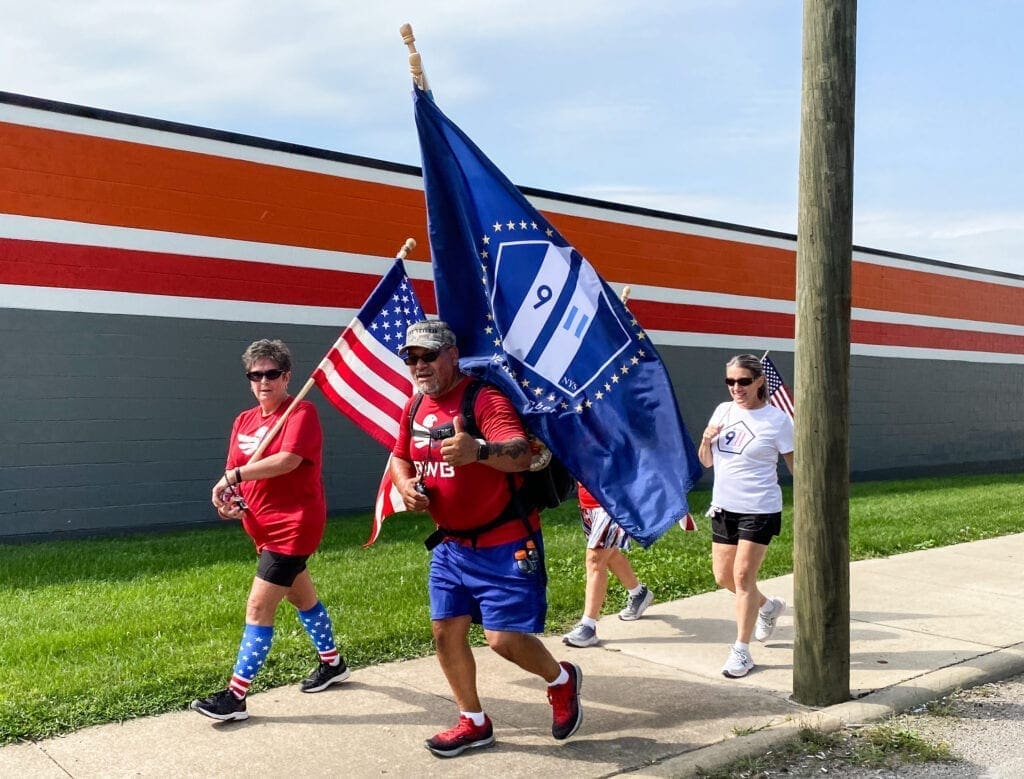 People walking with flags.