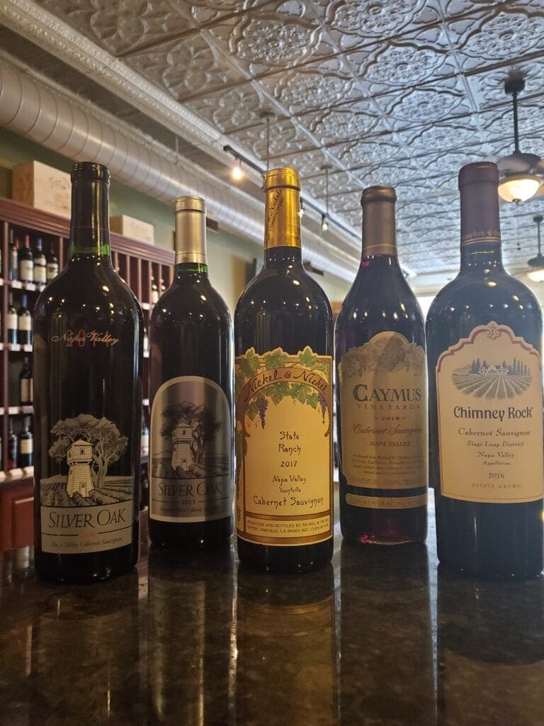 A photo of five bottles of wine.