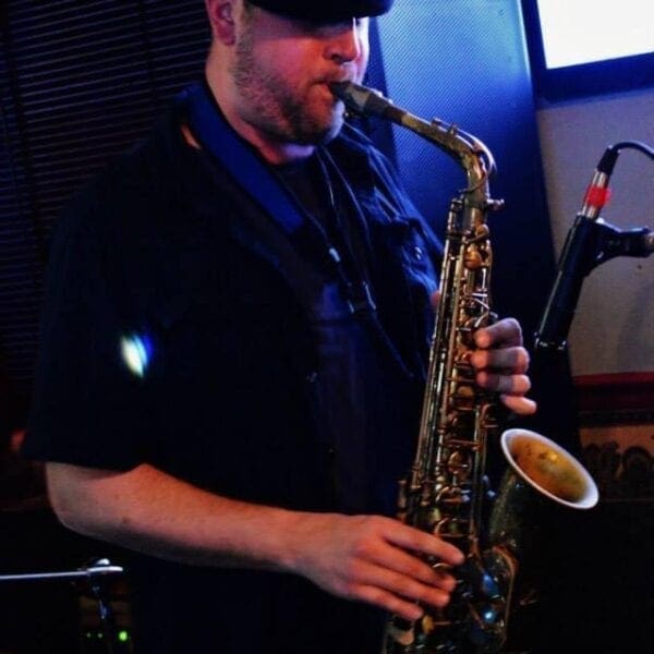 A man playing a saxophone.