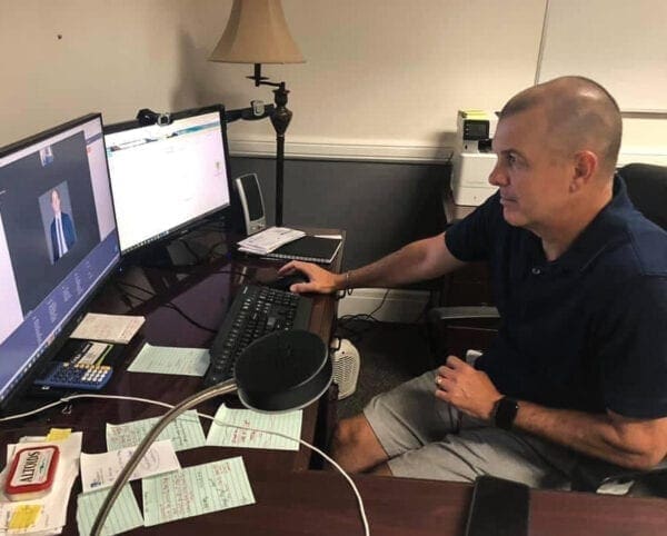 A man sitting at a desk.