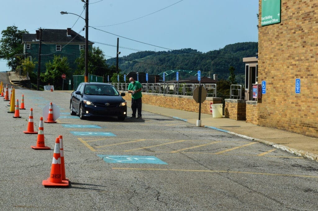 A car with people waiting to be tested for the coronavirus.