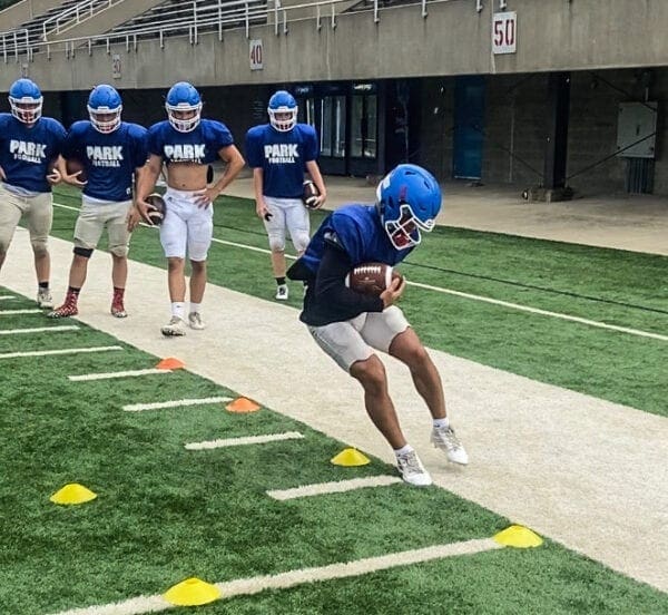 Players at a football practice.