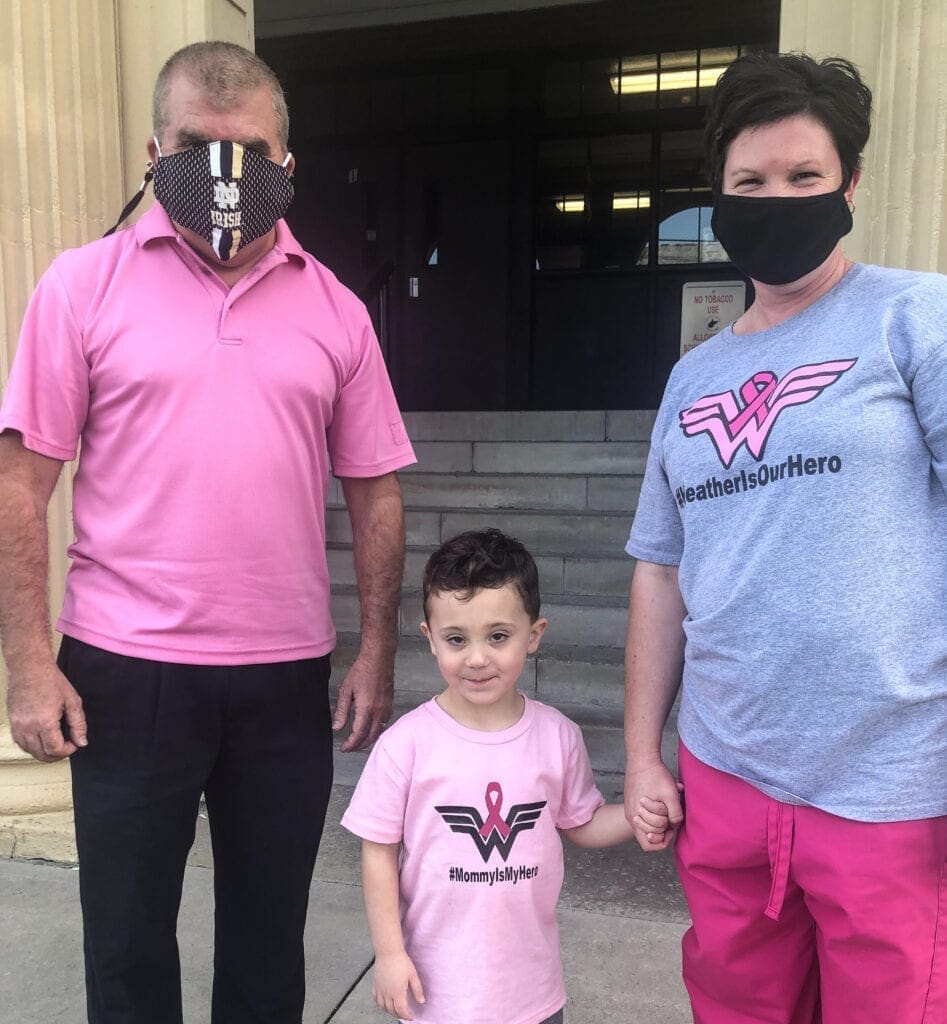 Three people wearing pink.