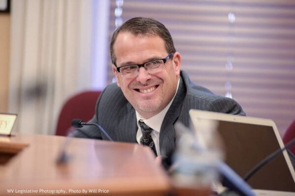 A lawmaker smiling.