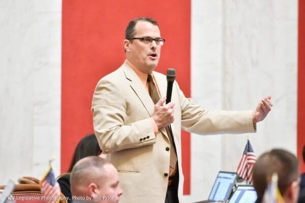 A man with a microphone speaking.