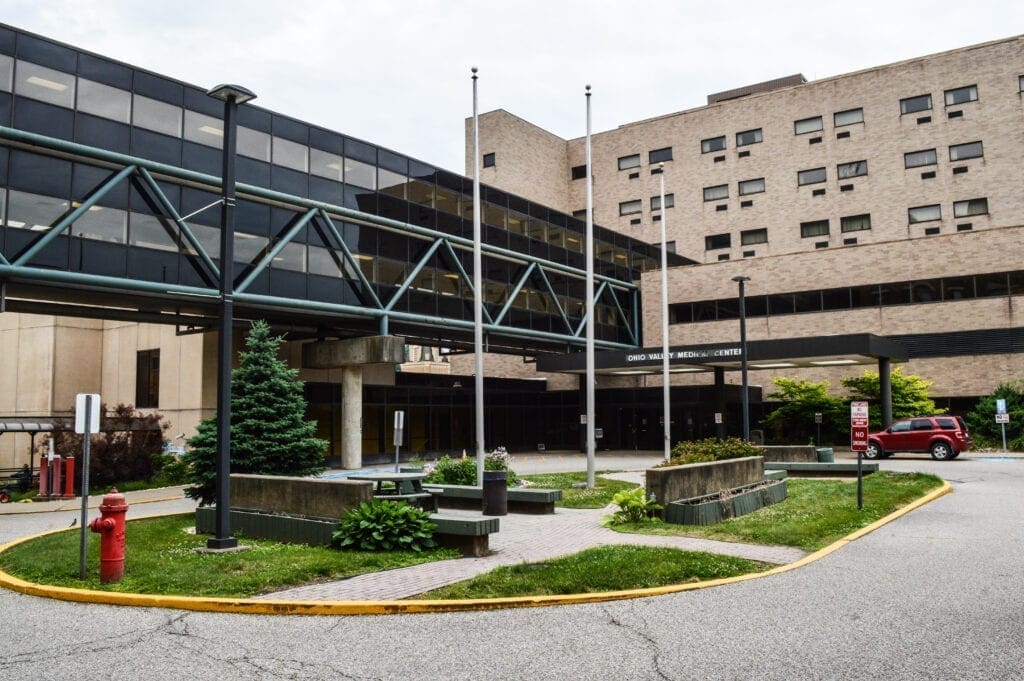 A courtyard in the middle of a hospital complex.