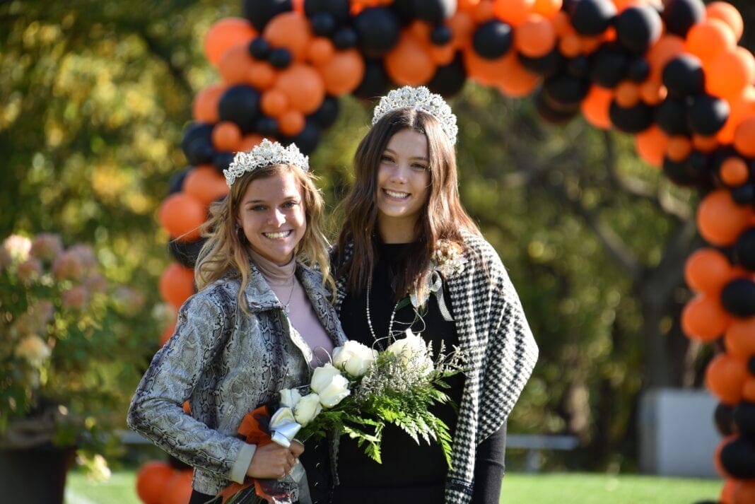 Two young ladies posing for a photo.