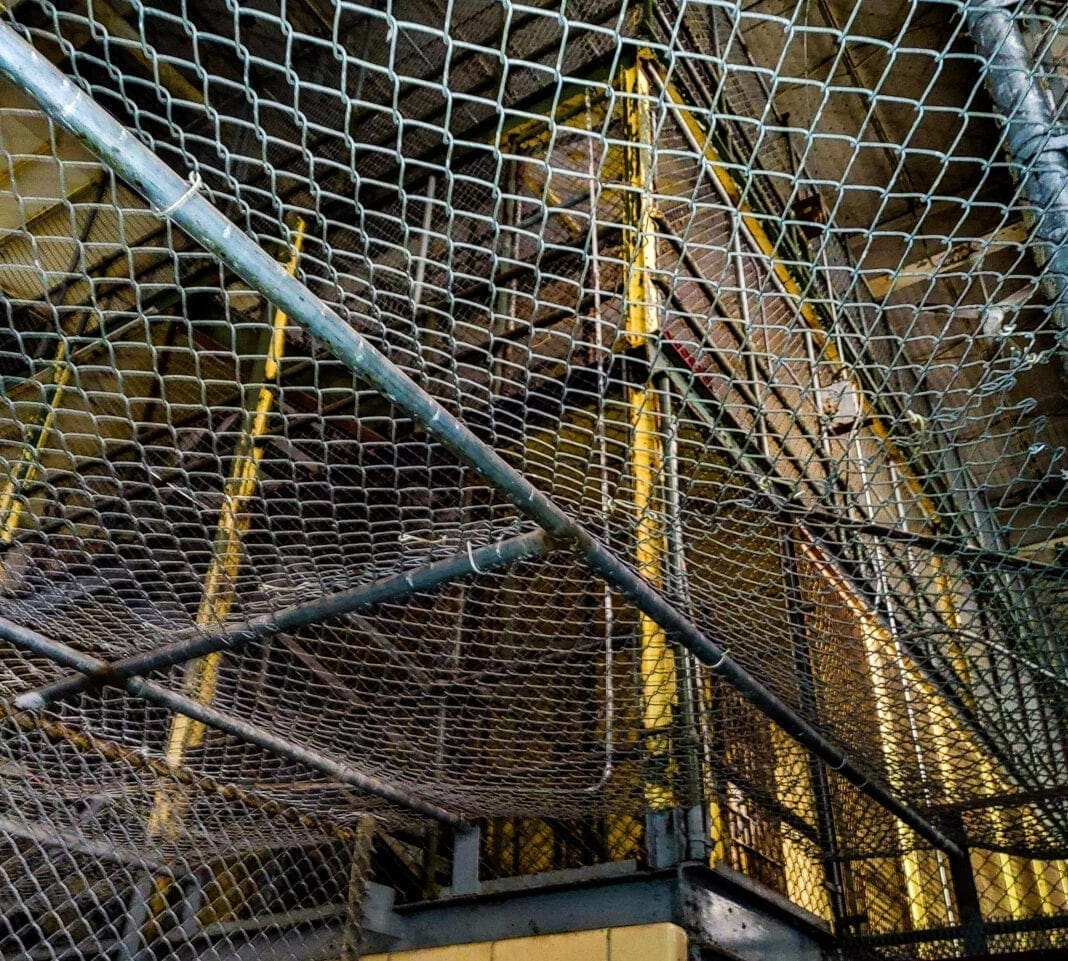 A ceiling made of fencing.