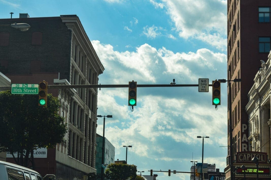 Green traffic lights are in the photo.