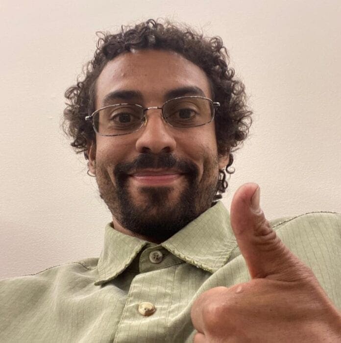 A man with his thumb up.