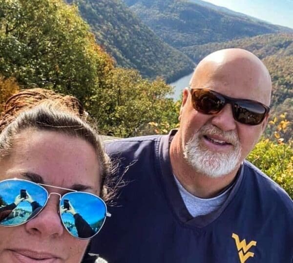 Two people above a gorge.