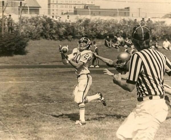 A historic photo of a football player.