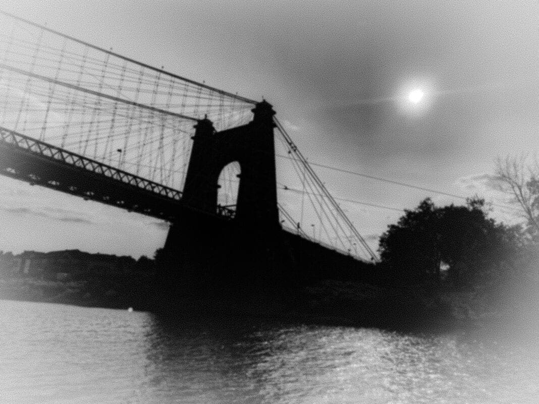 A photo of a foggy bridge.