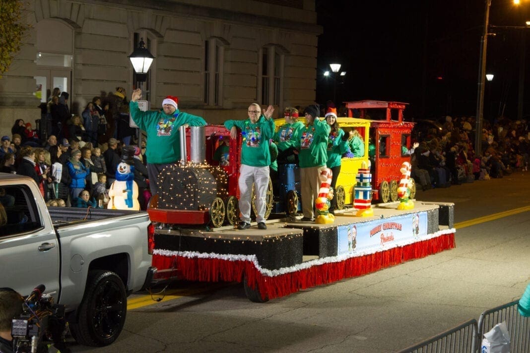 A parade float with people on it.