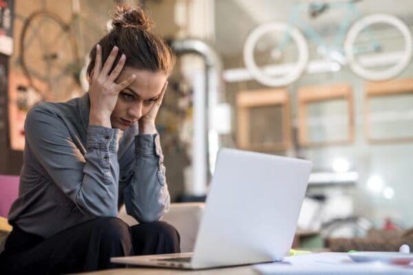 A female student frustrated with remote learning.