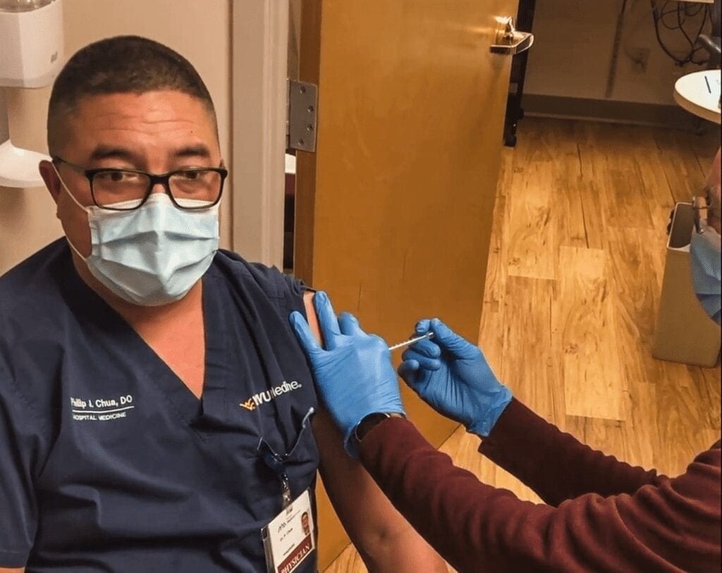 A man getting vaccinated.