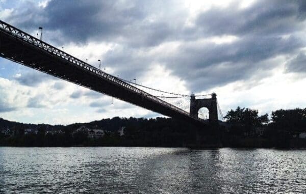 A suspension bridge over a river.