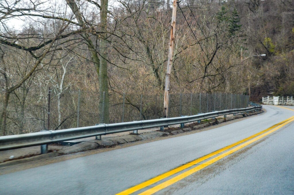 A closed walkway along a road.