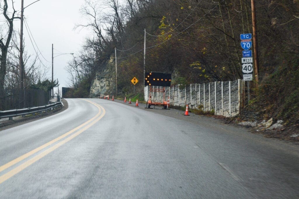 An orange arrow indicating a lane closure.