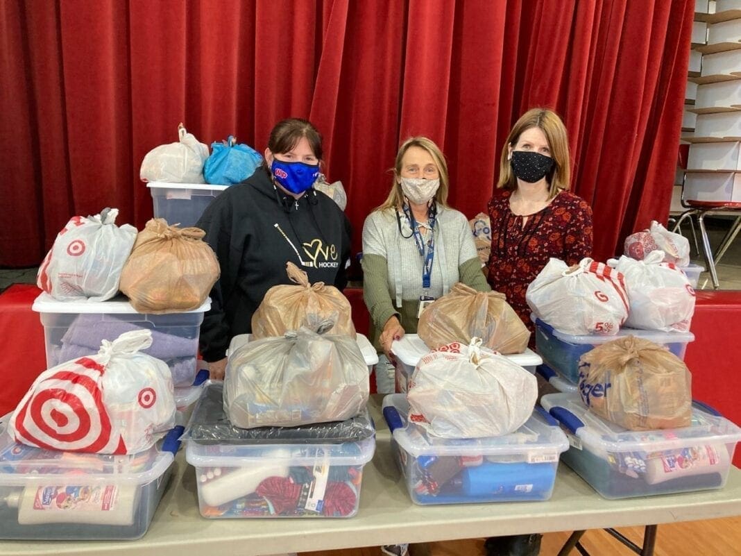 Three females with donations.