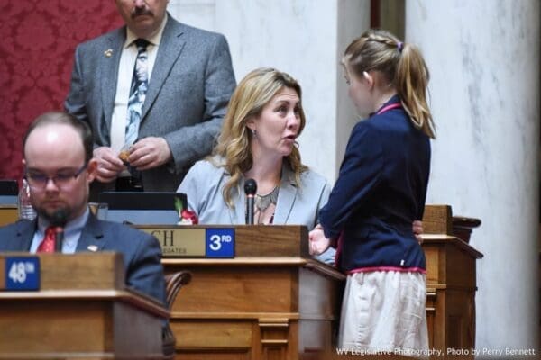 A mother speaking with a daughter.