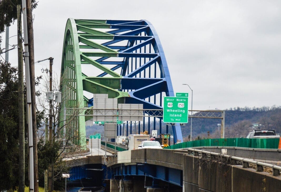 The superstructure of a bridge that spans a river.