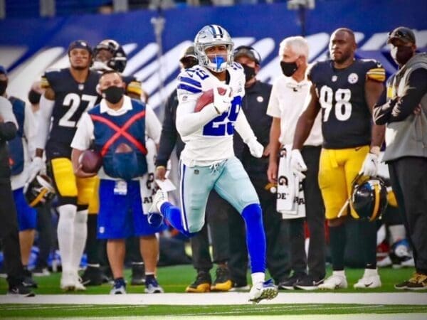 A football player running down the field.