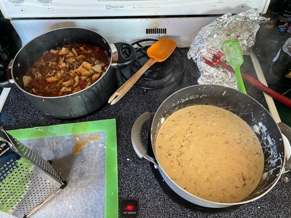 Two pots on a stovetop.