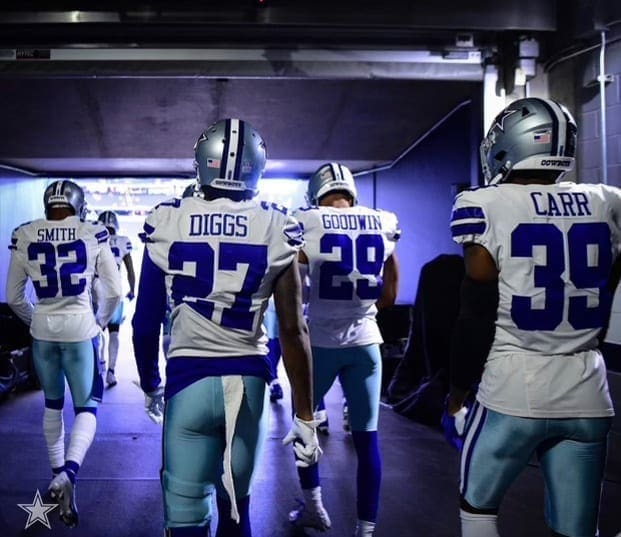 A few football players in the studeium tunnel.