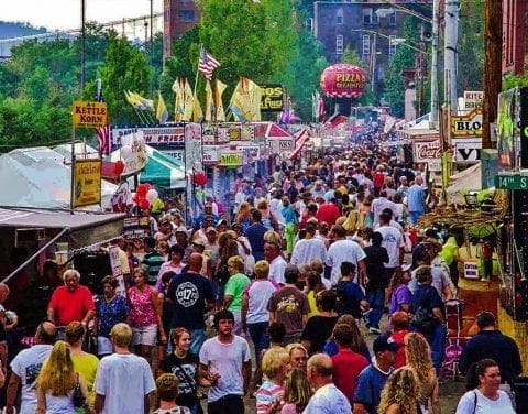 A large crowd on a street.