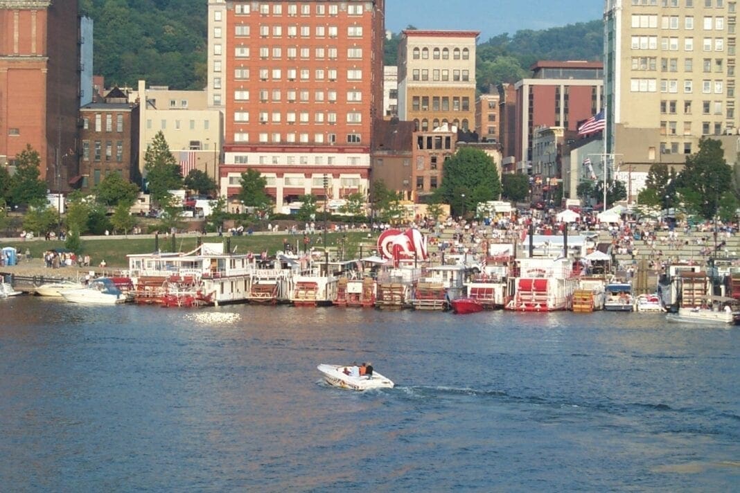 A riverfront with a lot of boats.