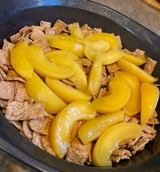 Peach slices on top of a cake mix.
