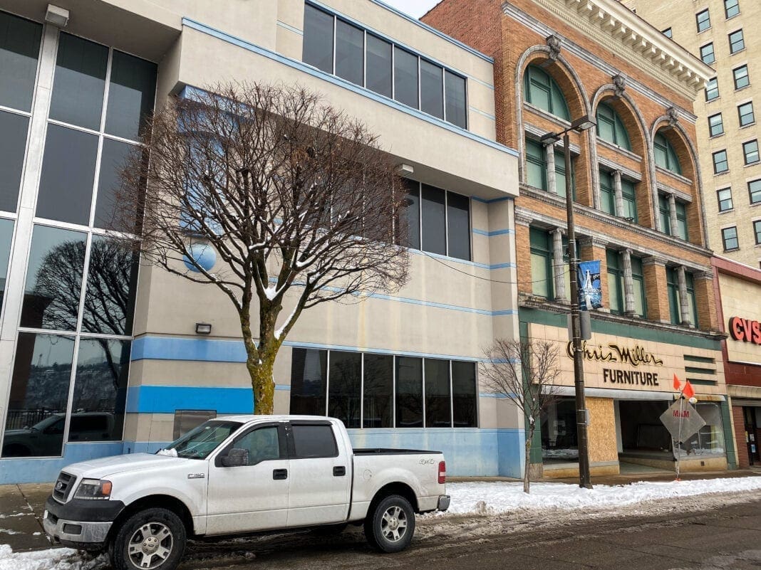 Two buildings along a downtown street.