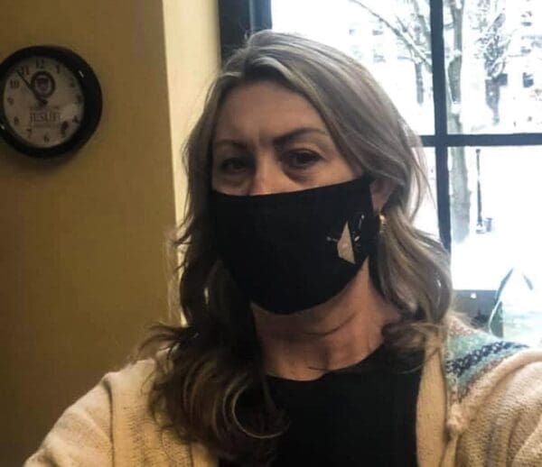 A woman wearing a mask.