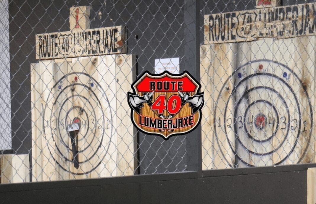 Two of the axe throwing targets are pictured with the Route 40 LumberJaxe logo in between